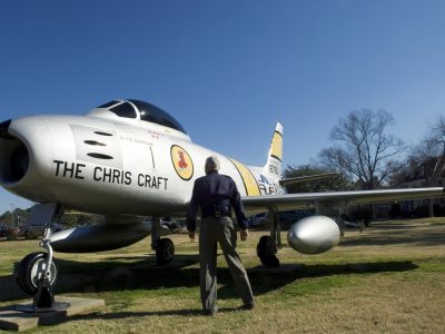 Retired Lt. Gen. Charles G. Cleveland stands before a remake 